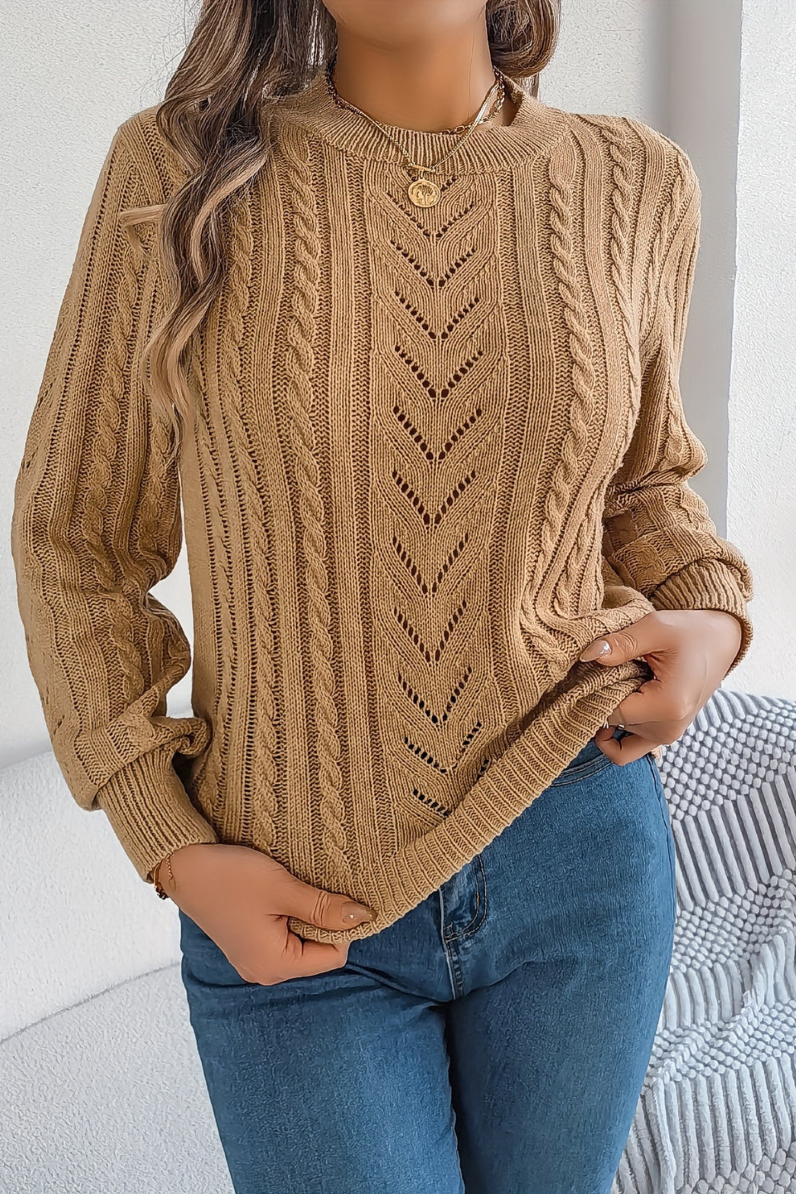 Cozy cable knit sweater for women featuring a stylish chevron pattern and trendy puff sleeves, perfect for fall and winter wear. 0