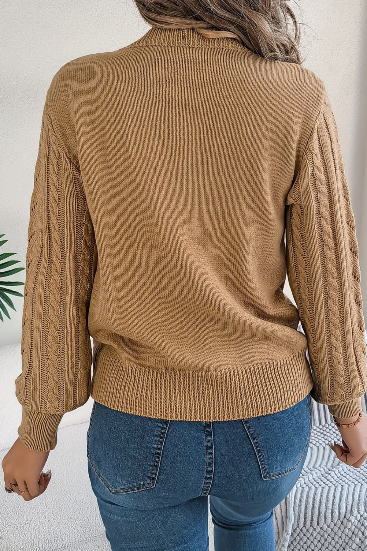 Cozy cable knit sweater for women featuring a stylish chevron pattern and trendy puff sleeves, perfect for fall and winter wear. 2