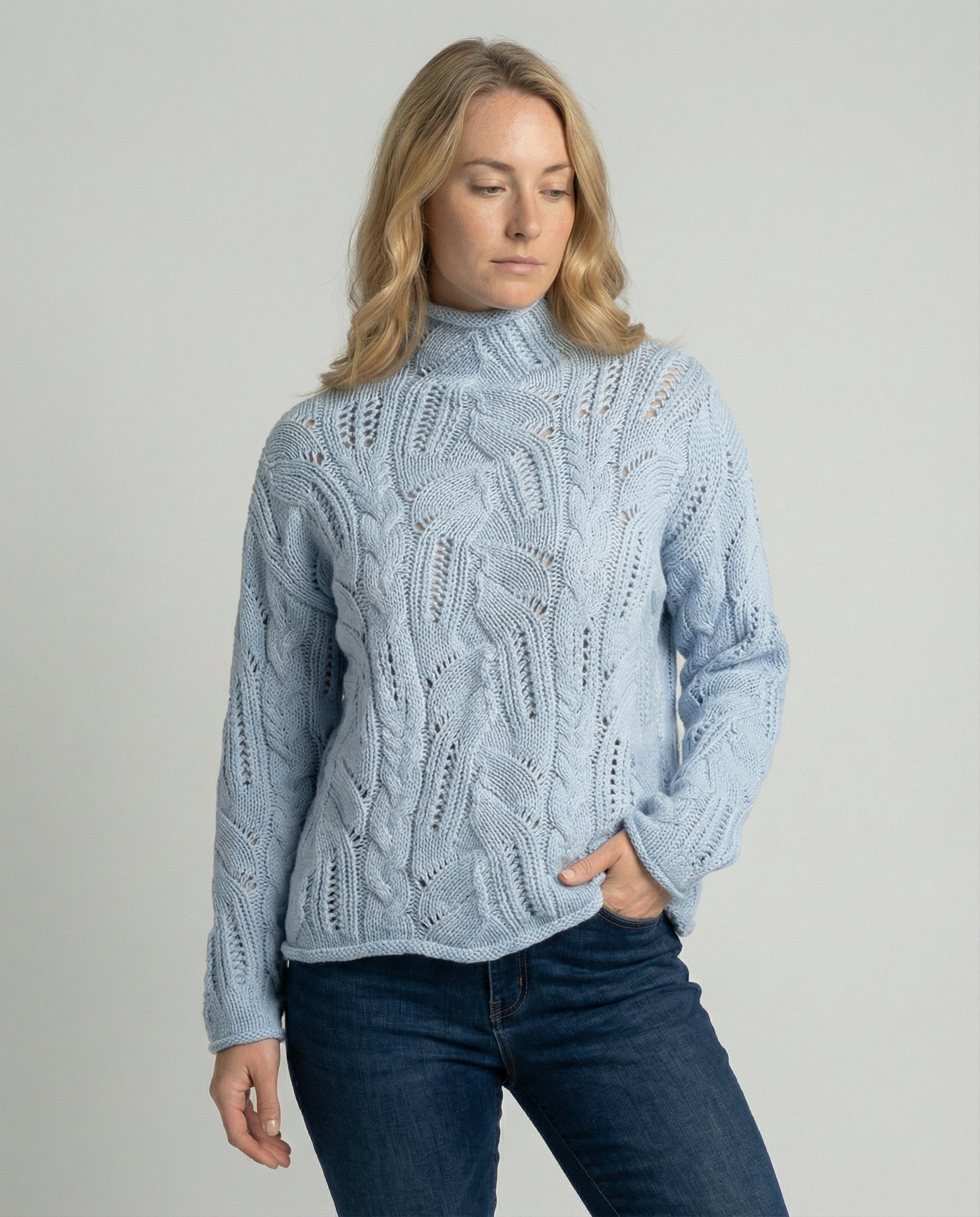 Soft chunky knit women's cable knit sweater featuring a cozy turtleneck and elegant pointelle detail, perfect for stylish winter layering. 0