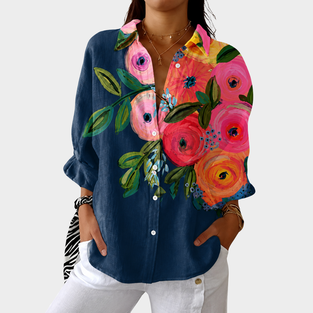 Colorful printed blouse featuring a flowing cut and vibrant floral patterns, ideal lightweight summer top for women. 0