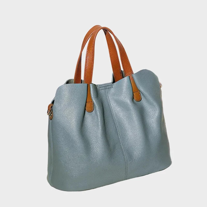 Genuine leather handbag with adjustable strap, featuring luxurious lychee grain cowhide, available in blue, black, pink, gray, and beige, designed 7