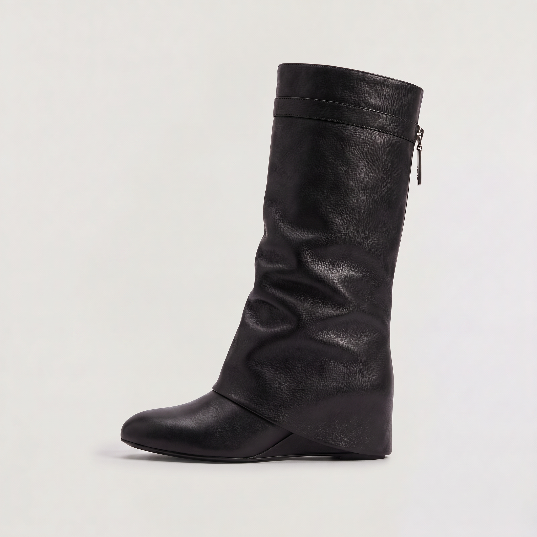 Knee high black boots for women featuring a stylish fold-over cuff and a comfortable low wedge heel, made with vegan upper materials. 0