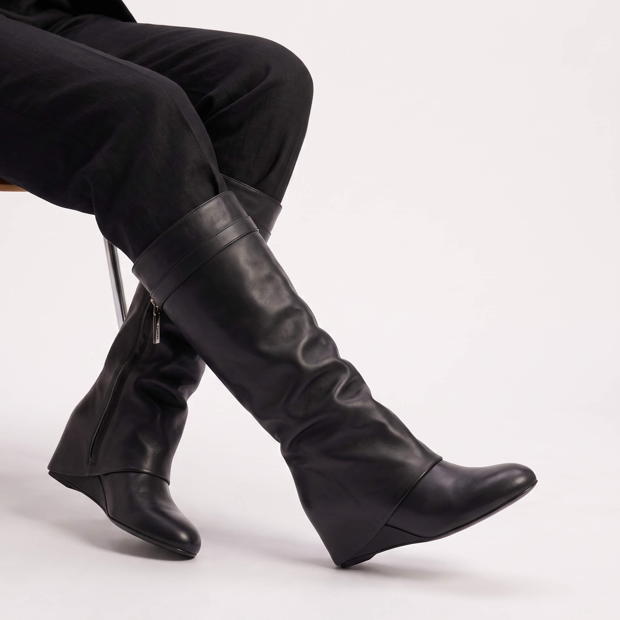 Knee high black boots for women featuring a stylish fold-over cuff and a comfortable low wedge heel, made with vegan upper materials. 3