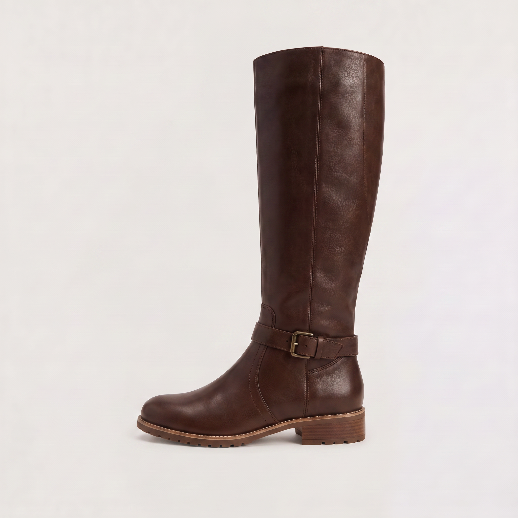 Knee high black riding boots for women with buckled ankle strap, made from faux leather and featuring a low stacked heel. 1
