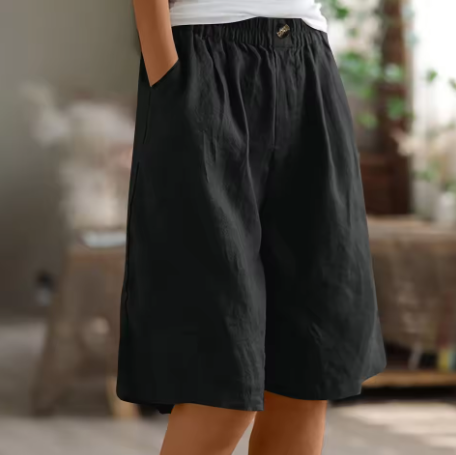 Linen shorts with elastic waist and deep side pockets, featuring a breathable relaxed fit perfect for both men and women. 10
