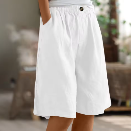 Linen shorts with elastic waist and deep side pockets, featuring a breathable relaxed fit perfect for both men and women. 11
