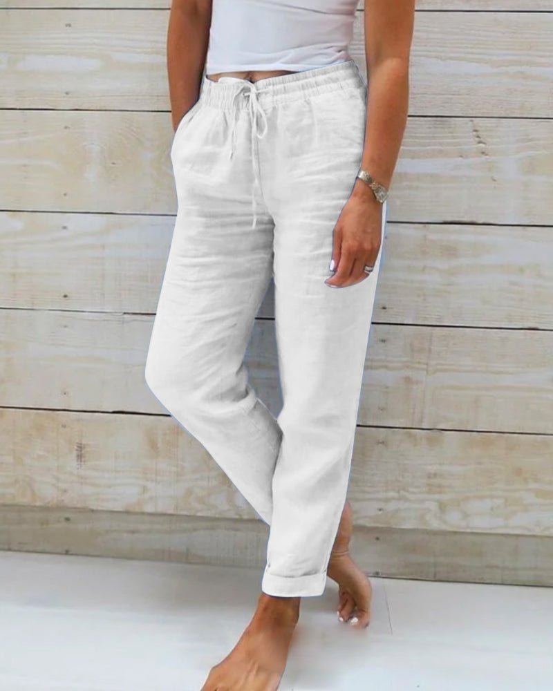 Linen trousers with drawstring waist and straight leg, featuring a relaxed fit and cropped design, perfect for women's summer fashion in white. 5