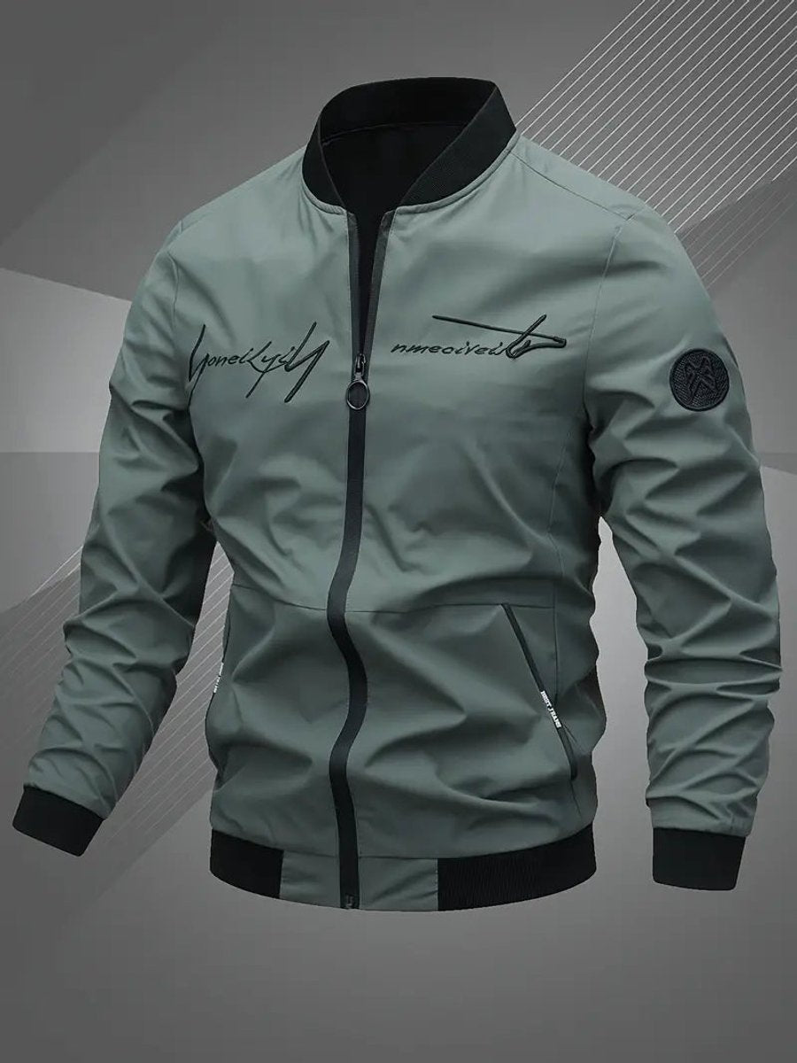 Men's black polyester bomber jacket featuring a zip-up front, baseball collar, and stylish embroidered detail. 5