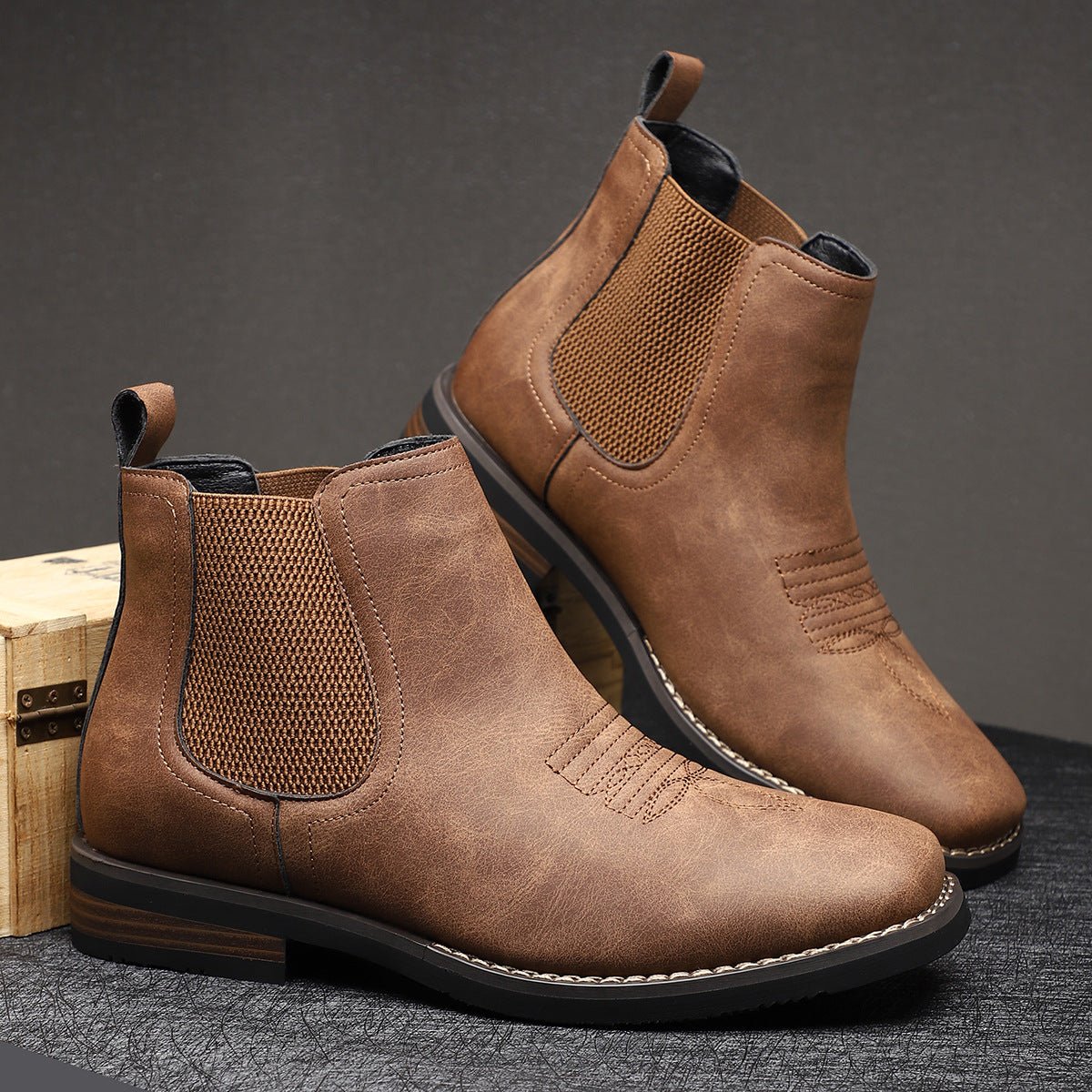Men's tan faux leather Chelsea boots featuring elastic side panels and western stitching, perfect for stylish casual wear. 0
