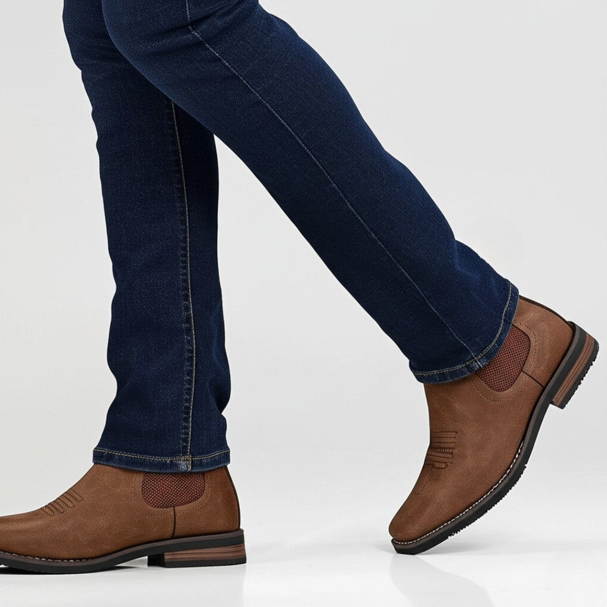 Men's tan faux leather Chelsea boots featuring elastic side panels and western stitching, perfect for stylish casual wear. 3