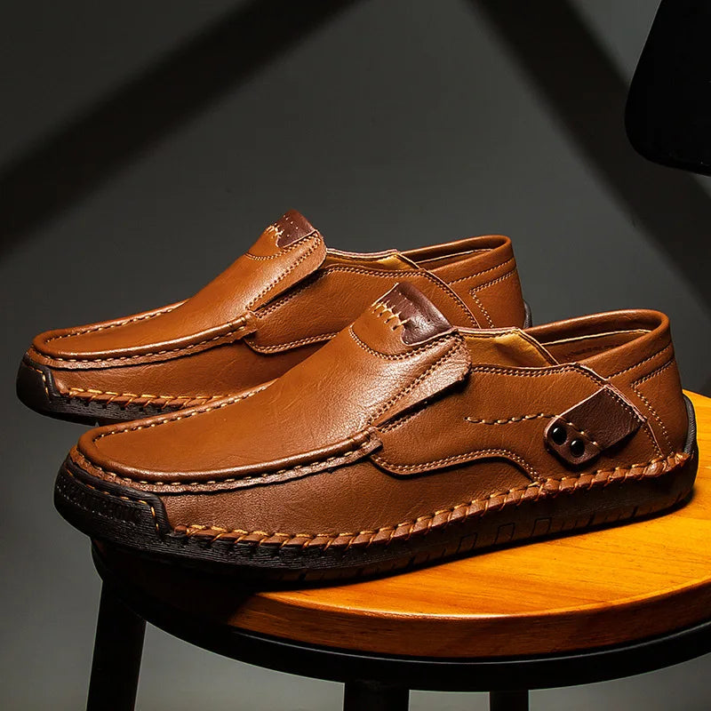 Men's leather slip-on loafers featuring a cushioned insole and a glossy finish, ideal for both casual and formal occasions. 4