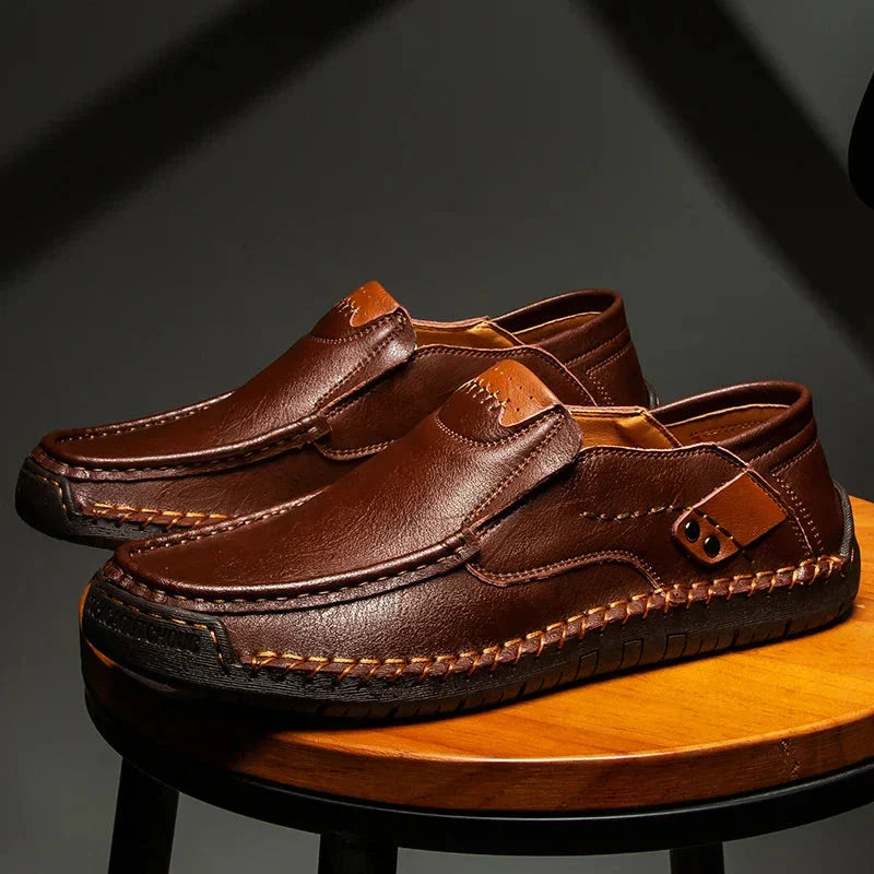 Men's leather slip-on loafers featuring a cushioned insole and a glossy finish, ideal for both casual and formal occasions. 5