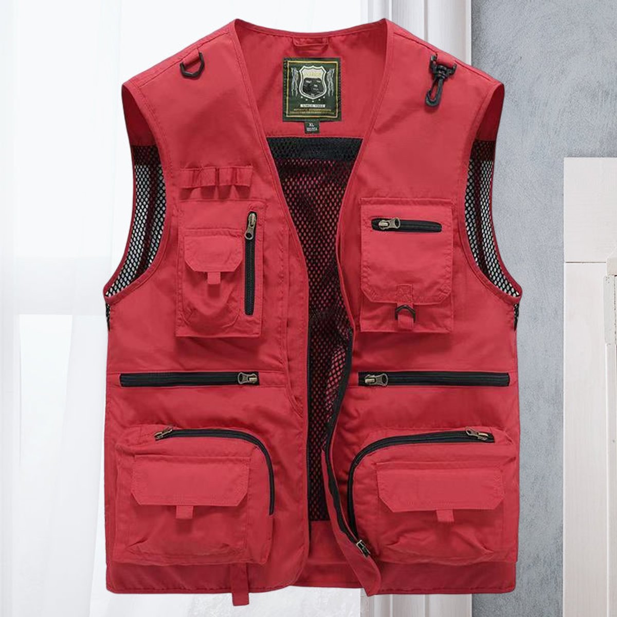 Men's lightweight polyester vest featuring a breathable mesh back and multi-pocket design, ideal for outdoor activities such as hiking, camping, and fishing. 0