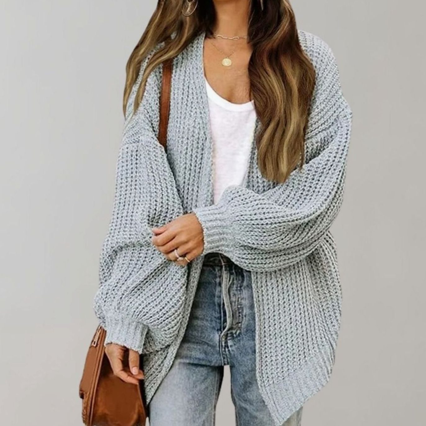 Oversized chunky knit cardigan with balloon sleeves, featuring a soft open front design, perfect for women's layering in cool weather. 2