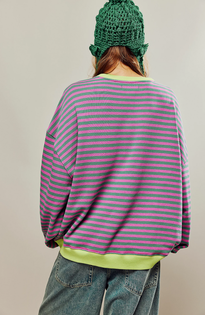 Oversized striped sweatshirt featuring neon contrast trim and drop shoulders, perfect for a stylish and comfortable casual look. 1