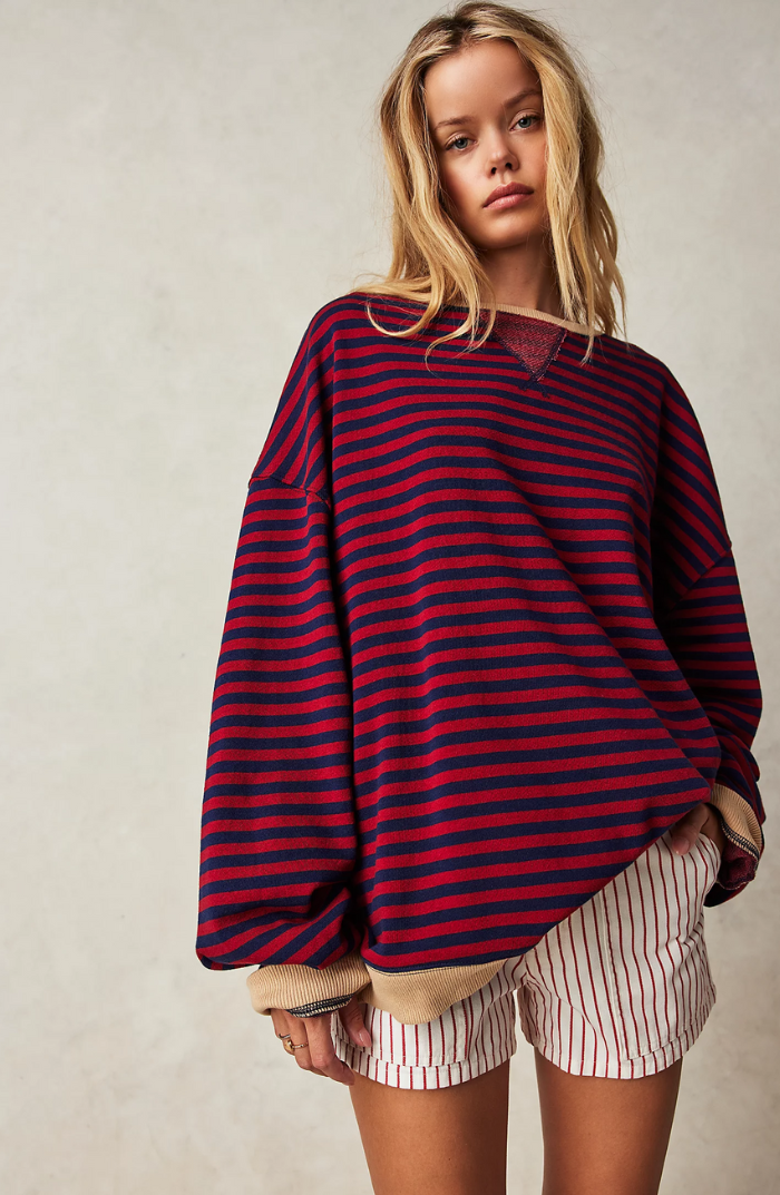 Oversized striped sweatshirt featuring neon contrast trim and drop shoulders, perfect for a stylish and comfortable casual look. 8