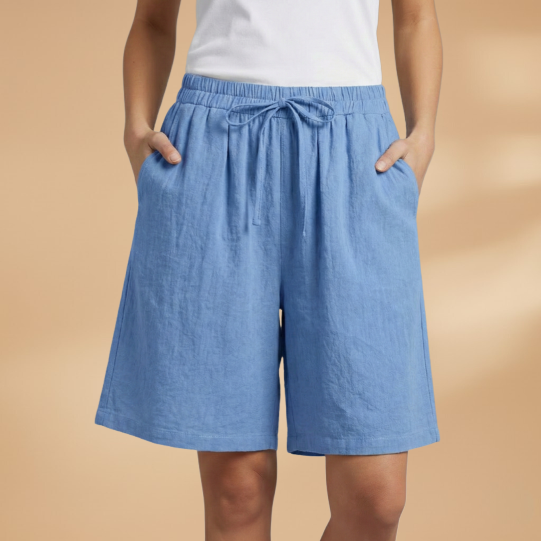 Lightweight relaxed linen shorts for women featuring an elastic waist and drawstring, perfect for summer wear. 12
