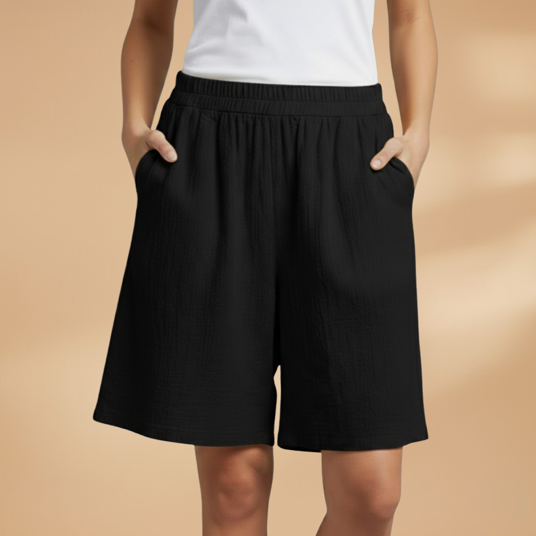 Lightweight relaxed linen shorts for women featuring an elastic waist and drawstring, perfect for summer wear. 5