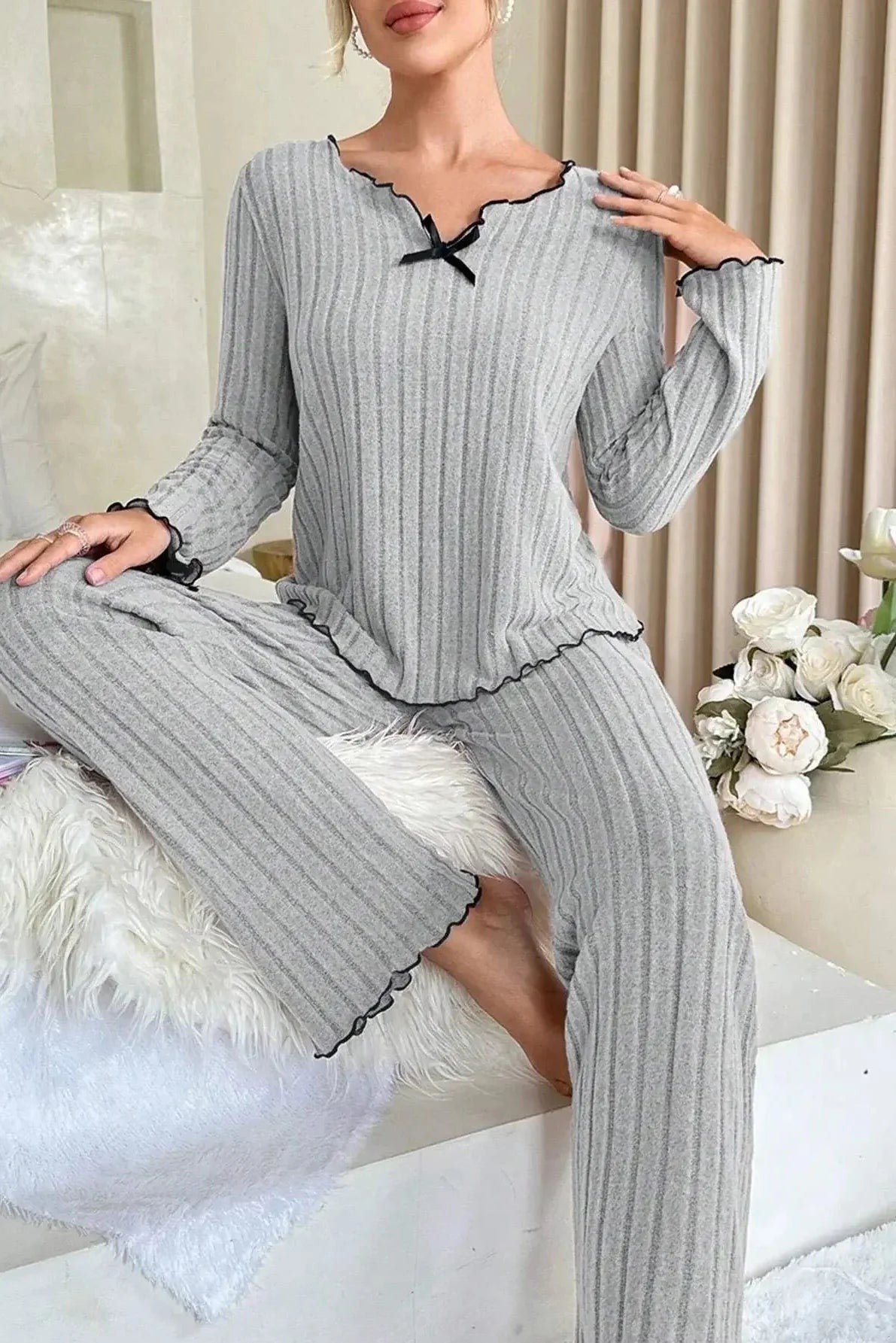 Ribbed knit women's pajama set featuring a relaxed full-length fit, lettuce edge detailing, and satin bow accent, available in rose pink, grey 3