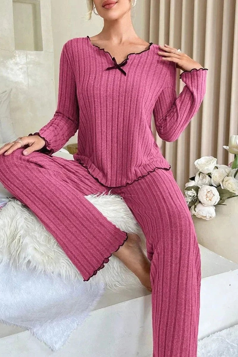 Ribbed knit women's pajama set featuring a relaxed full-length fit, lettuce edge detailing, and satin bow accent, available in rose pink, grey 8