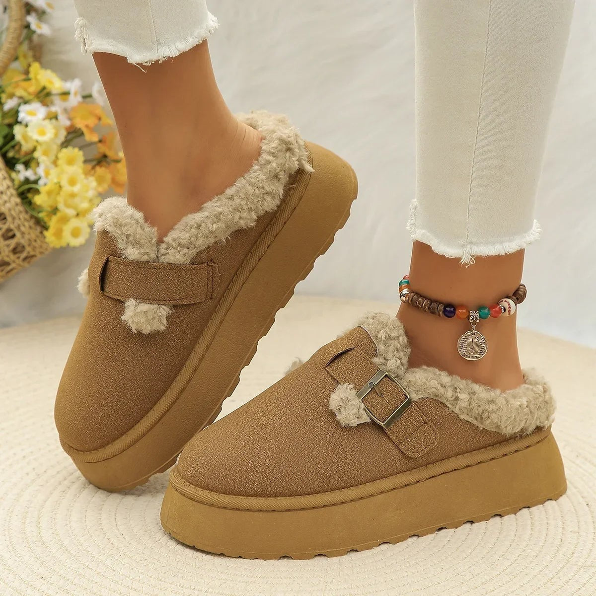 Suede slippers with plush lining and durable sole in brown, black, and white, offering slip-on comfort for indoor use. 0
