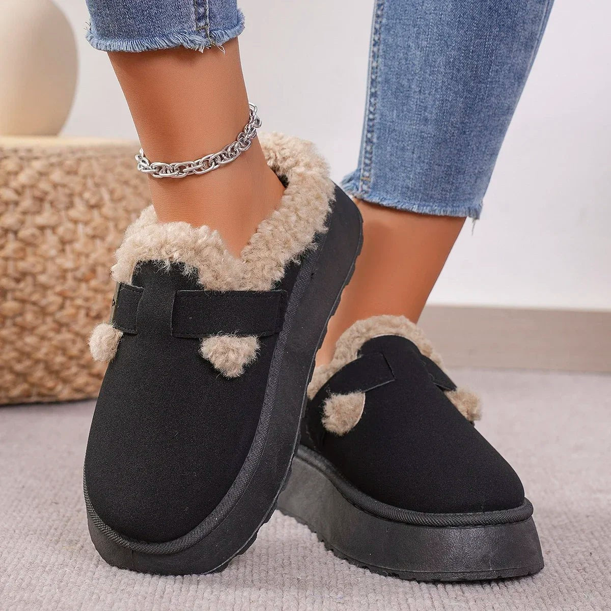 Suede slippers with plush lining and durable sole in brown, black, and white, offering slip-on comfort for indoor use. 4