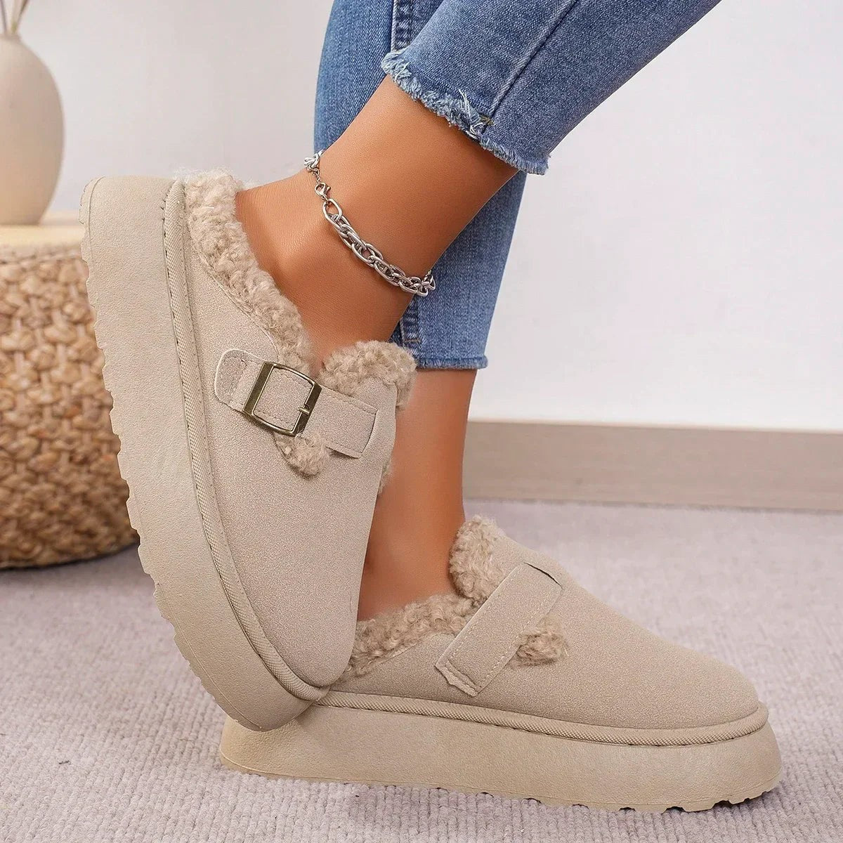 Suede slippers with plush lining and durable sole in brown, black, and white, offering slip-on comfort for indoor use. 5