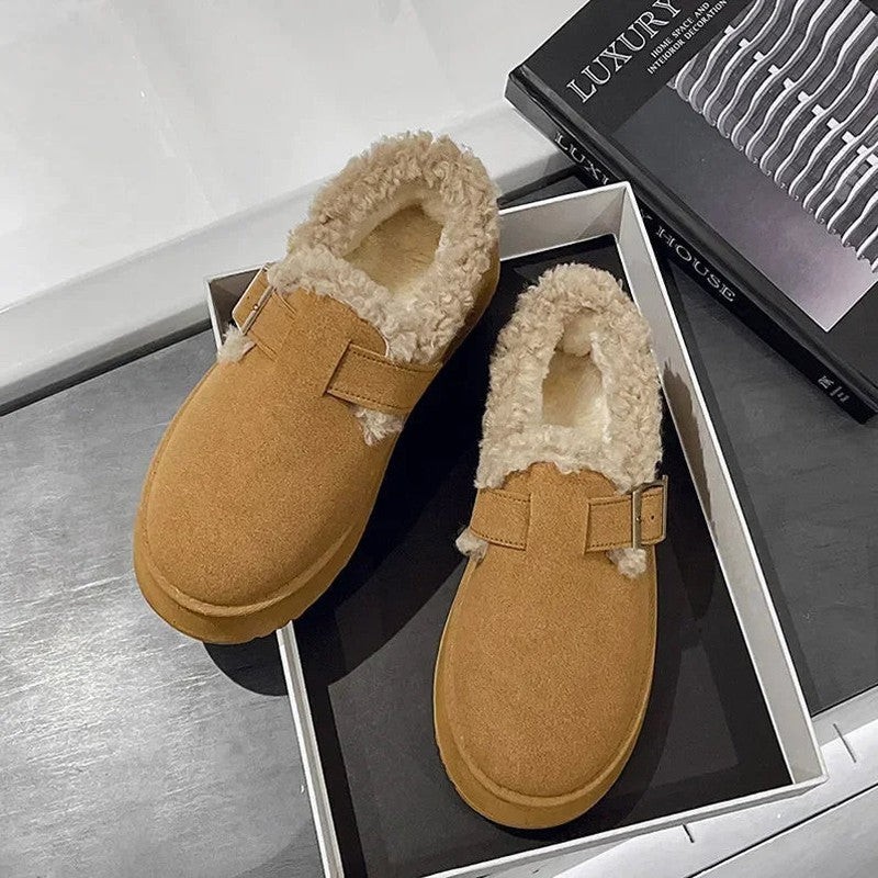 Suede slippers with plush lining and durable sole in brown, black, and white, offering slip-on comfort for indoor use. 6