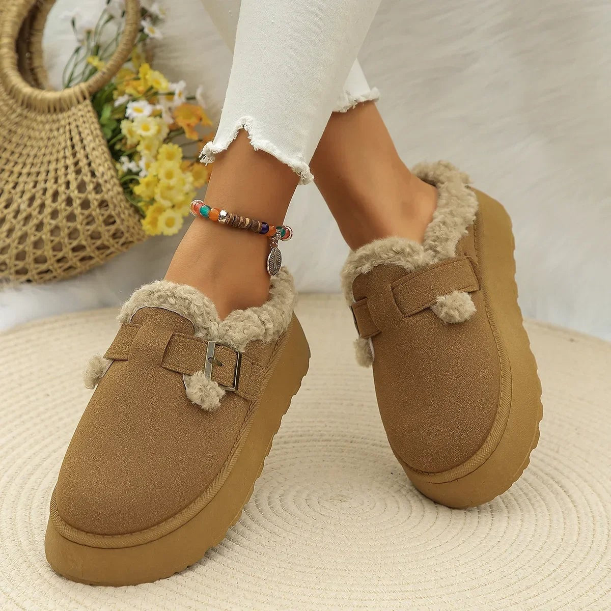 Suede slippers with plush lining and durable sole in brown, black, and white, offering slip-on comfort for indoor use. 7