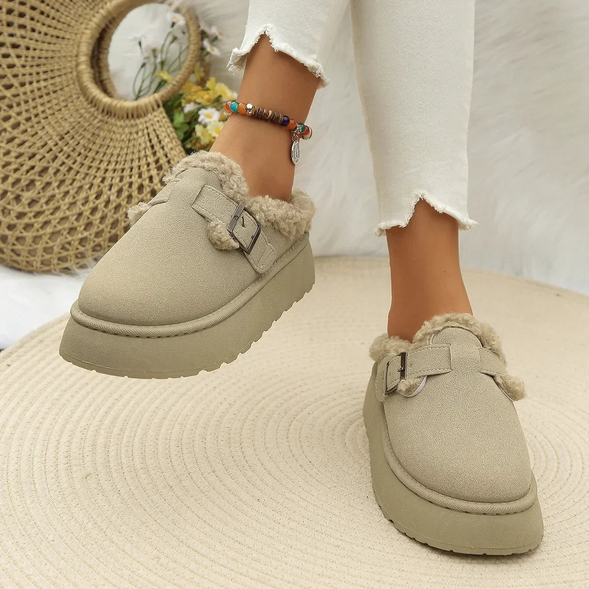 Suede slippers with plush lining and durable sole in brown, black, and white, offering slip-on comfort for indoor use. 8