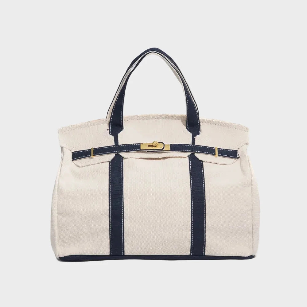 Vintage linen canvas tote bag featuring reinforced handles and a secure snap closure, designed for water resistance and ample space, perfect for everyday use. 0