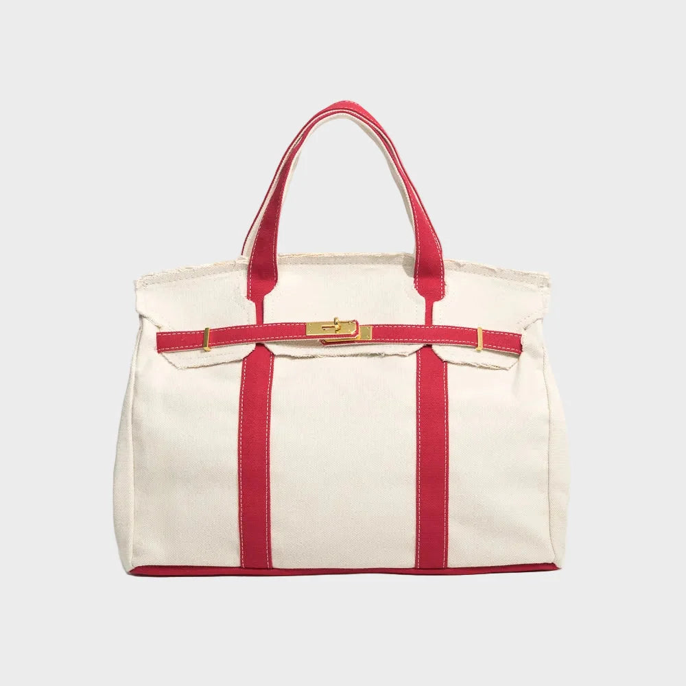 Vintage linen canvas tote bag featuring reinforced handles and a secure snap closure, designed for water resistance and ample space, perfect for everyday use. 3