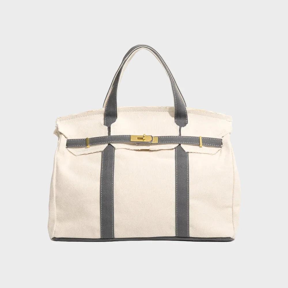 Vintage linen canvas tote bag featuring reinforced handles and a secure snap closure, designed for water resistance and ample space, perfect for everyday use. 4