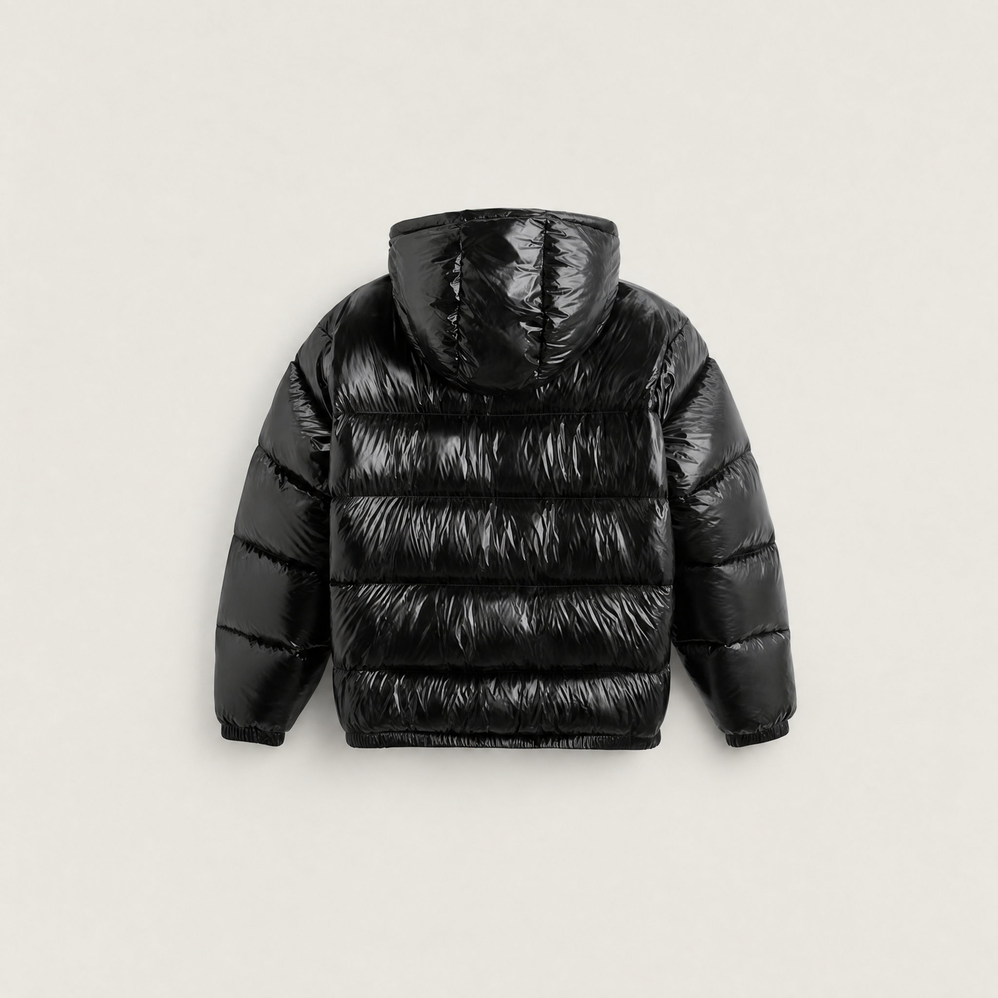 Women's black puffer jacket featuring a stylish attached hood, glossy quilted design, and convenient zip pockets, designed for a relaxed fit perfect for winter wear 6