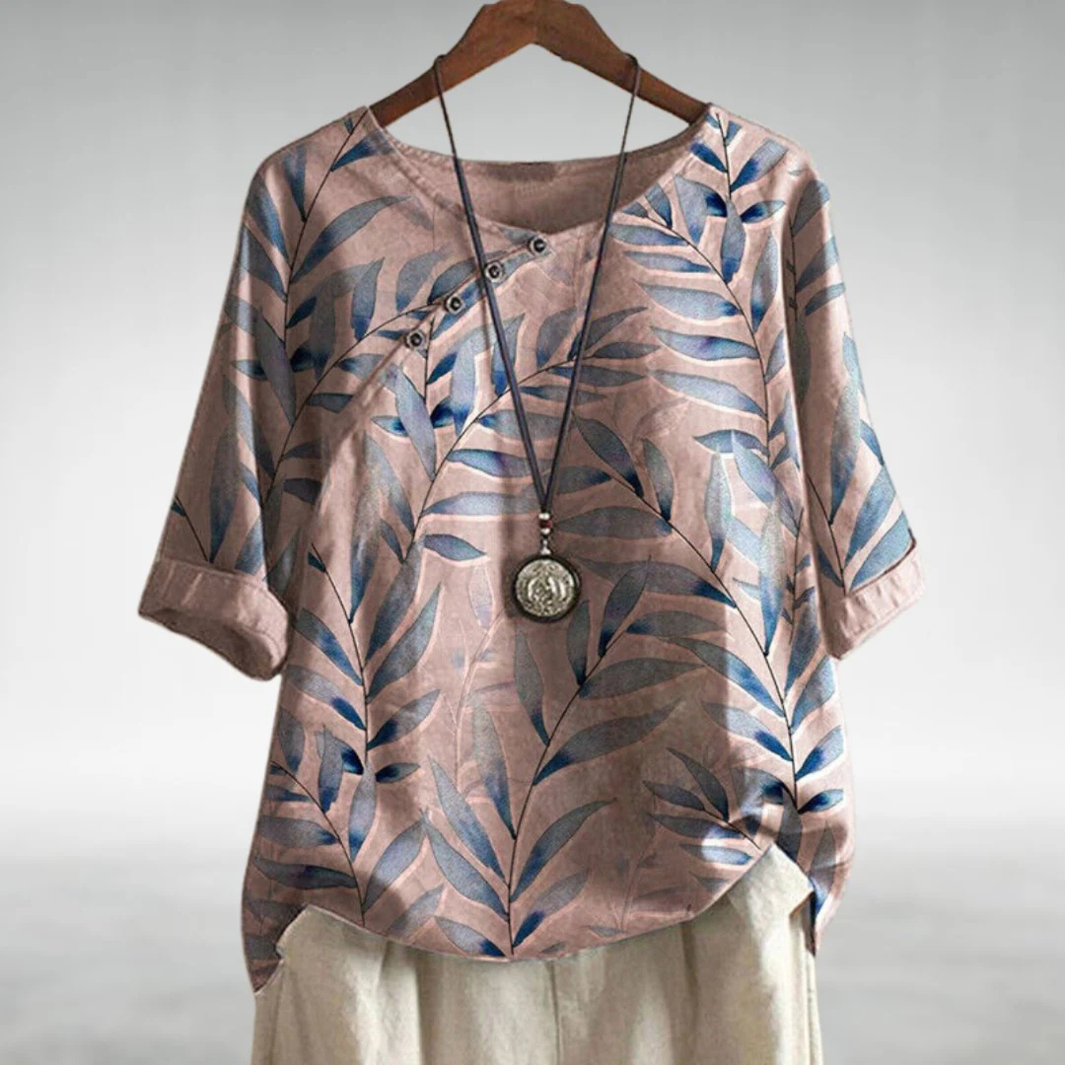 Women's lightweight summer blouse featuring a vibrant floral print, relaxed fit, and stylish three-quarter sleeves, perfect for warm weather outings. 3