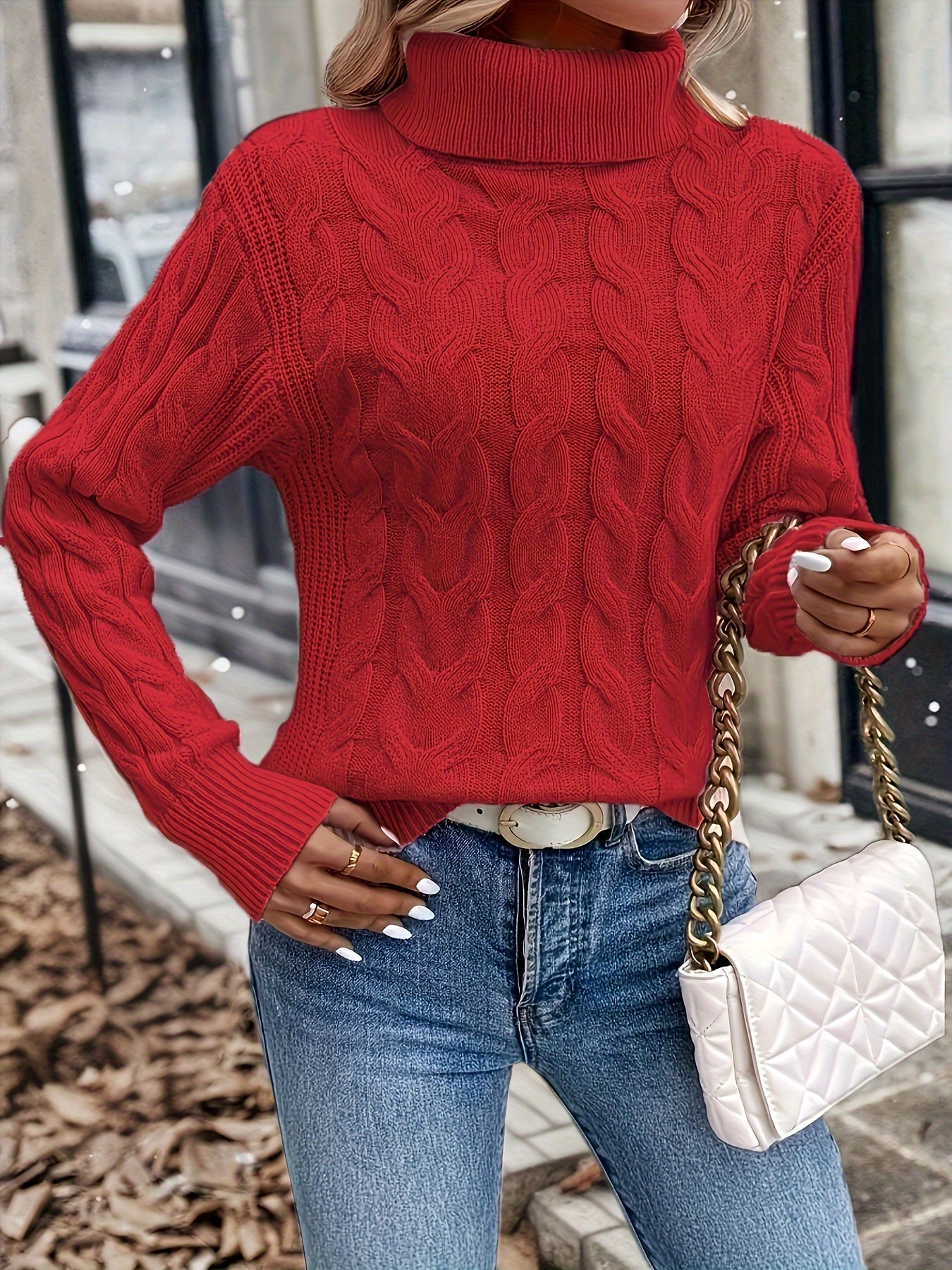 Women's cable-knit turtleneck sweater featuring a relaxed fit, perfect for cozy warmth during autumn and winter seasons. 3