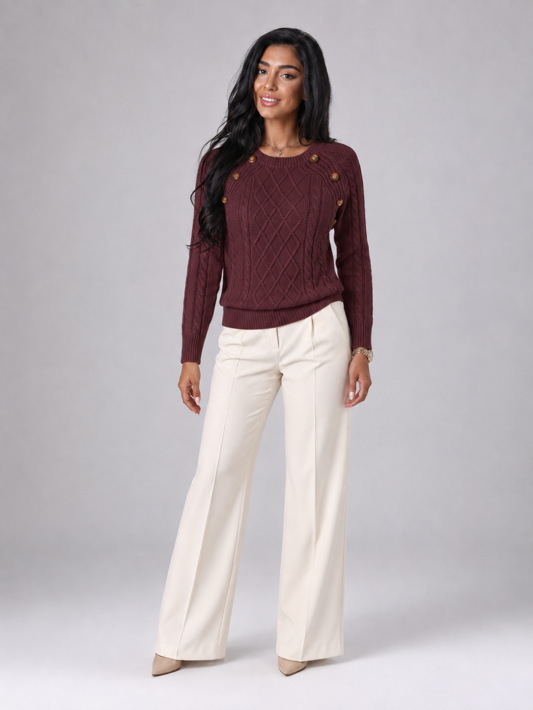 Women's cable knit sweater featuring button shoulder detail, crew neck design, and a stylish diamond knit pattern in a cozy and fashionable look. 2