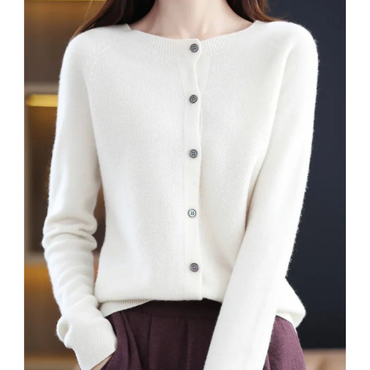Women's black cardigan featuring a button front and relaxed fit, made from soft stretch knit fabric, perfect for layering and comfortable wear. 0