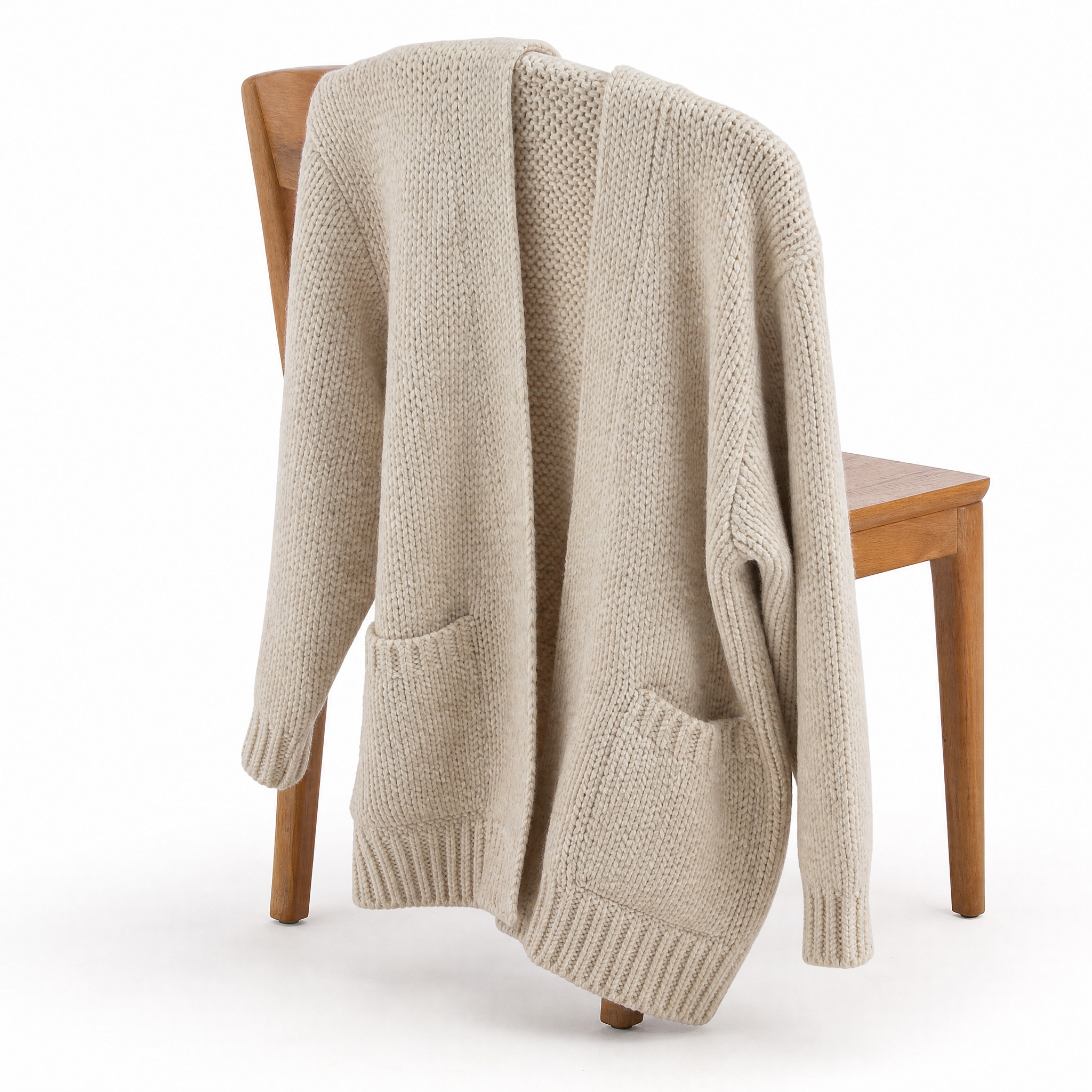 Women's chunky knit cardigan featuring an open front design, crafted from a soft wool-blend in oatmeal cream, designed for a relaxed fit. 4