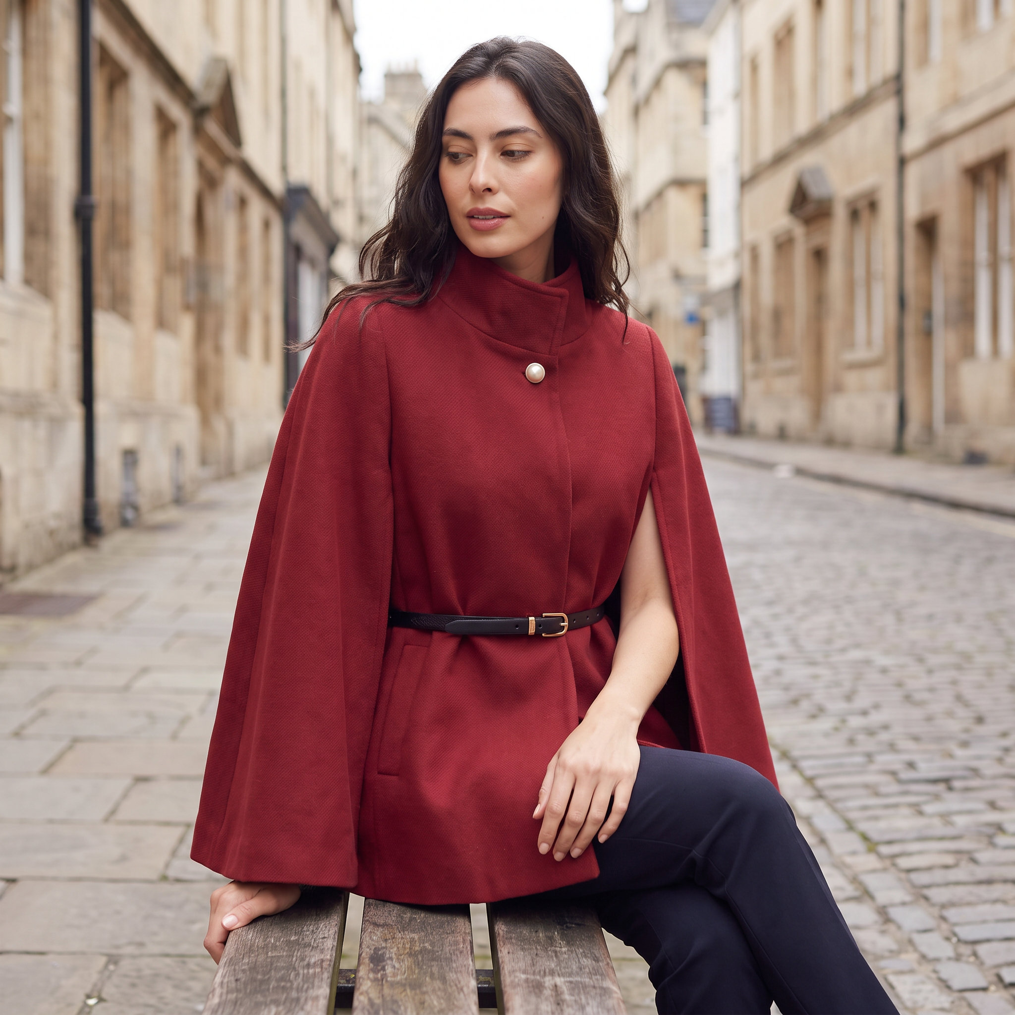 Women's cloak coat featuring an adjustable waist belt and relaxed batwing sleeves, designed for elegant layering and stylish comfort. 2