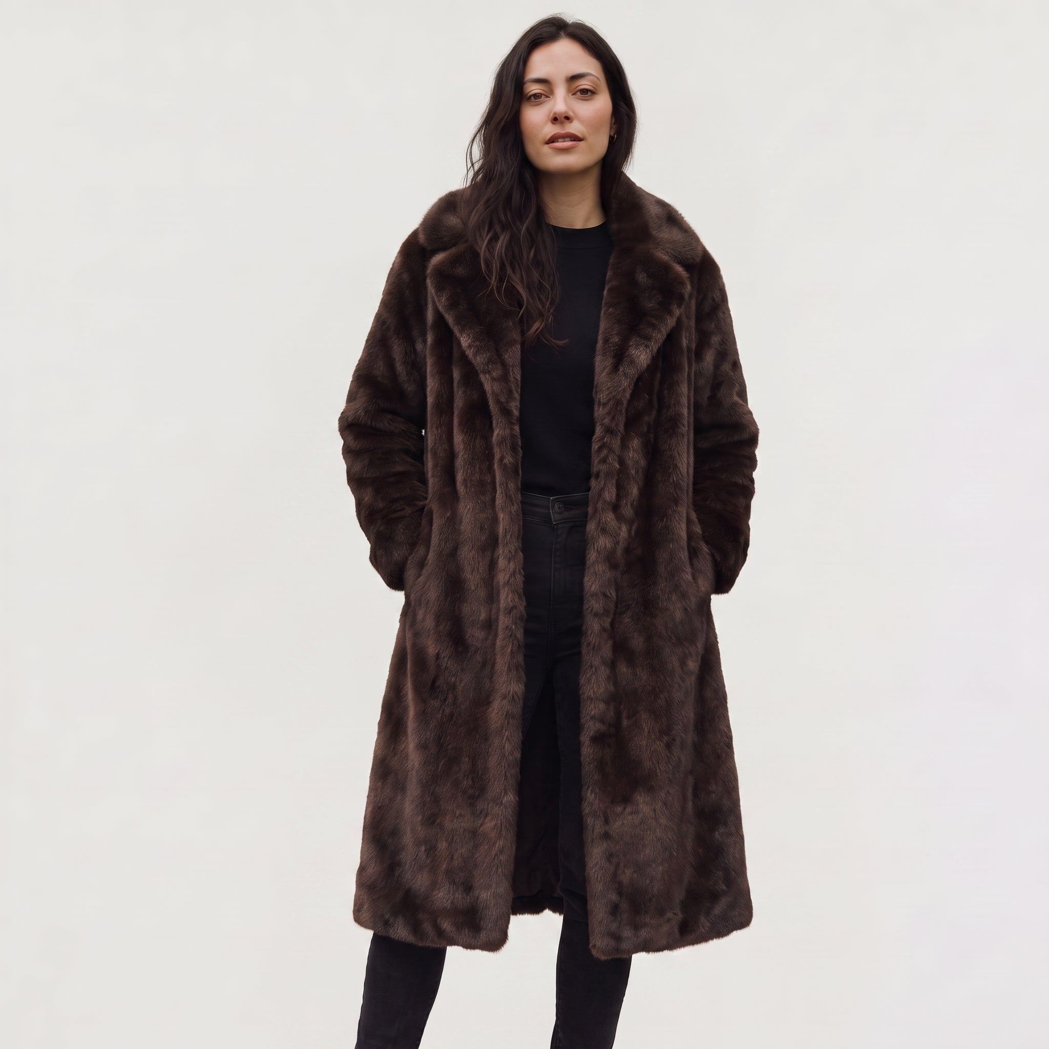Women's faux fur trench coat featuring double-button fastening, side pockets, and a long relaxed fit, perfect for stylish winter outerwear. 0