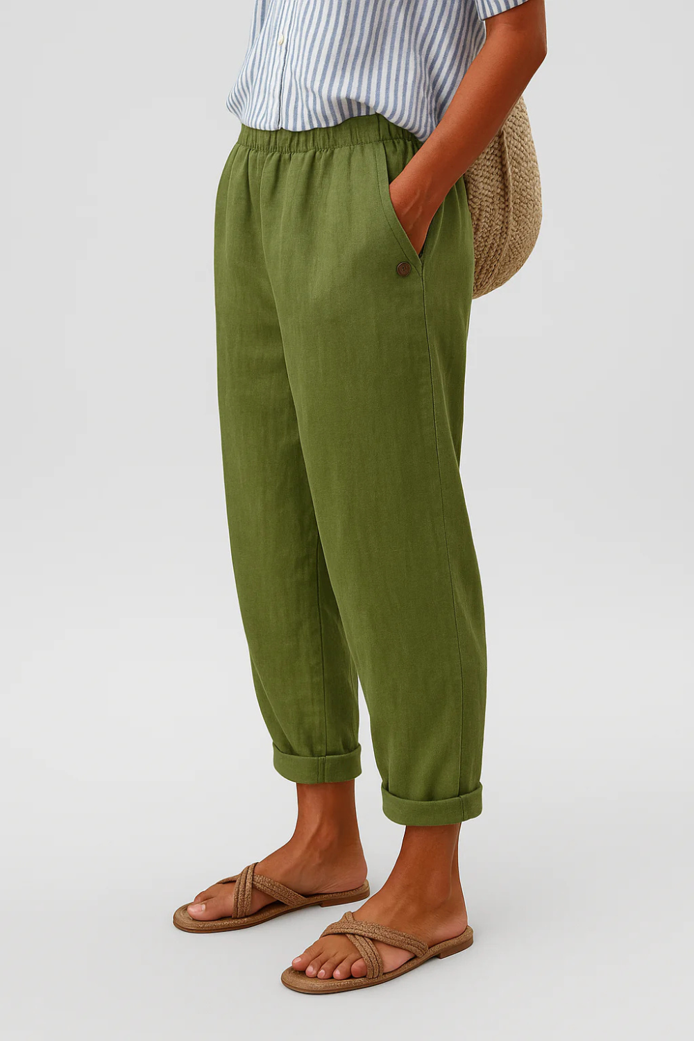 Women's linen pants featuring an elastic waistband and tapered design, perfect for casual wear; breathable and lightweight fabric ideal for warm weather. 1