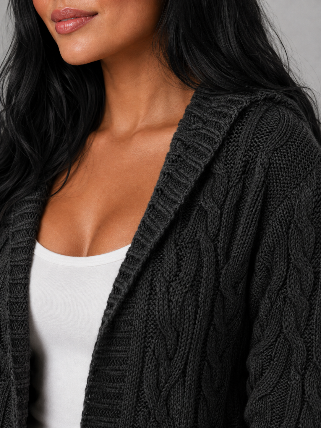 Women's long cardigan sweater featuring a cozy hood and functional pockets, designed with a chunky cable knit pattern and an open front for a stylish and comfortable look. 5