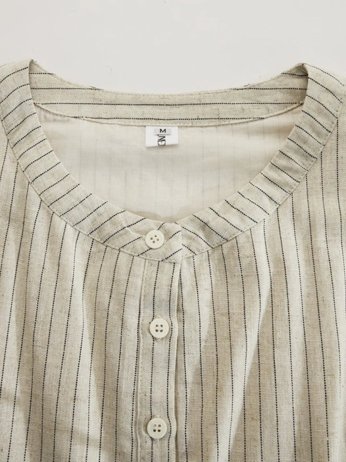 Women's maxi dress featuring a striped button-down front, side pockets, and a lightweight breathable design, perfect for summer wear. 4