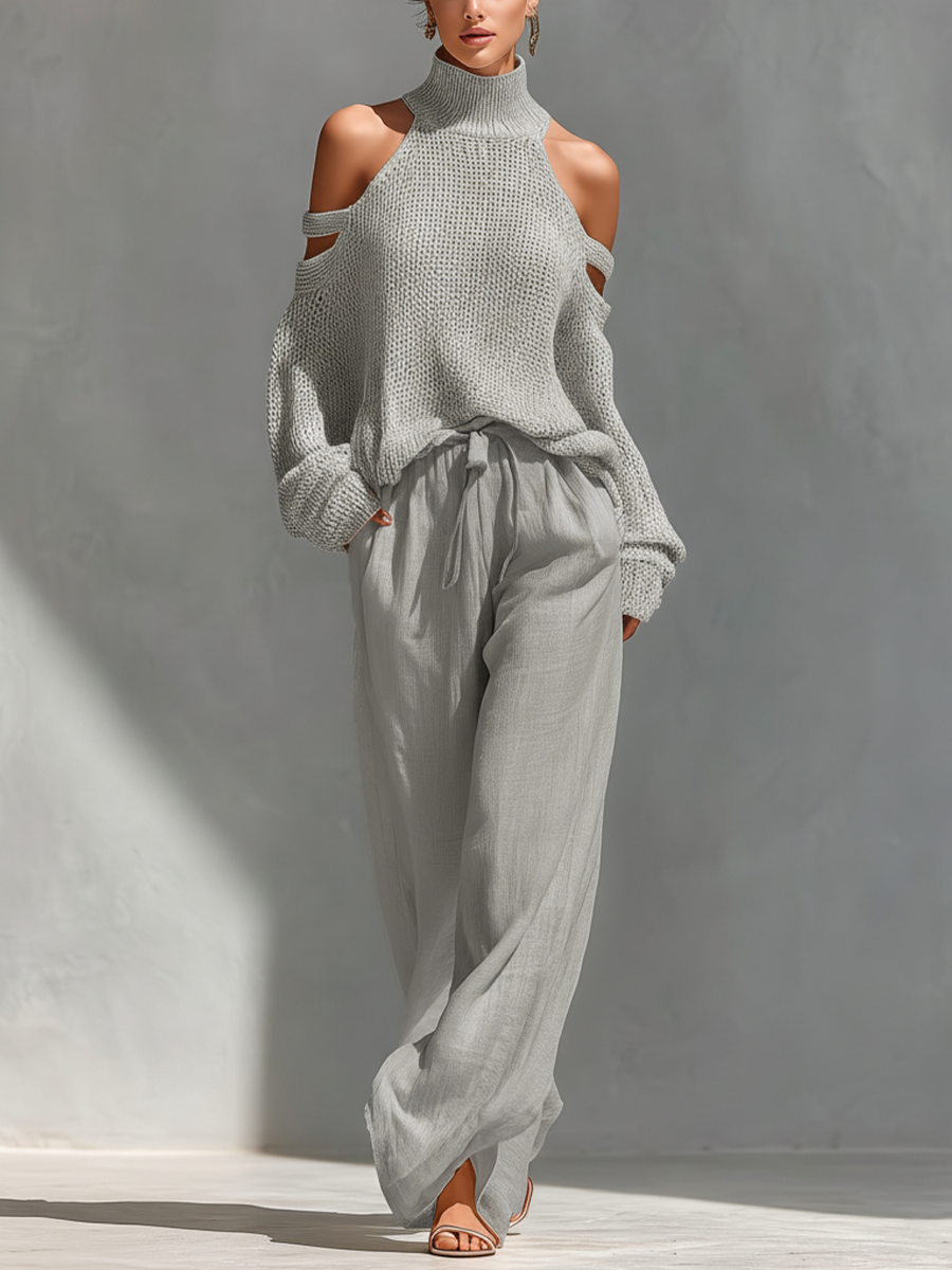 Women's outfit set featuring a beige cold-shoulder knit turtleneck top paired with wide-leg pants, showcasing a modern and comfortable style perfect for casual 2