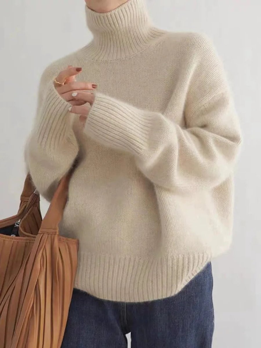Women's oversized cashmere sweater featuring a cozy turtleneck design, crafted from soft knit fabric for ultimate comfort and warmth. 0