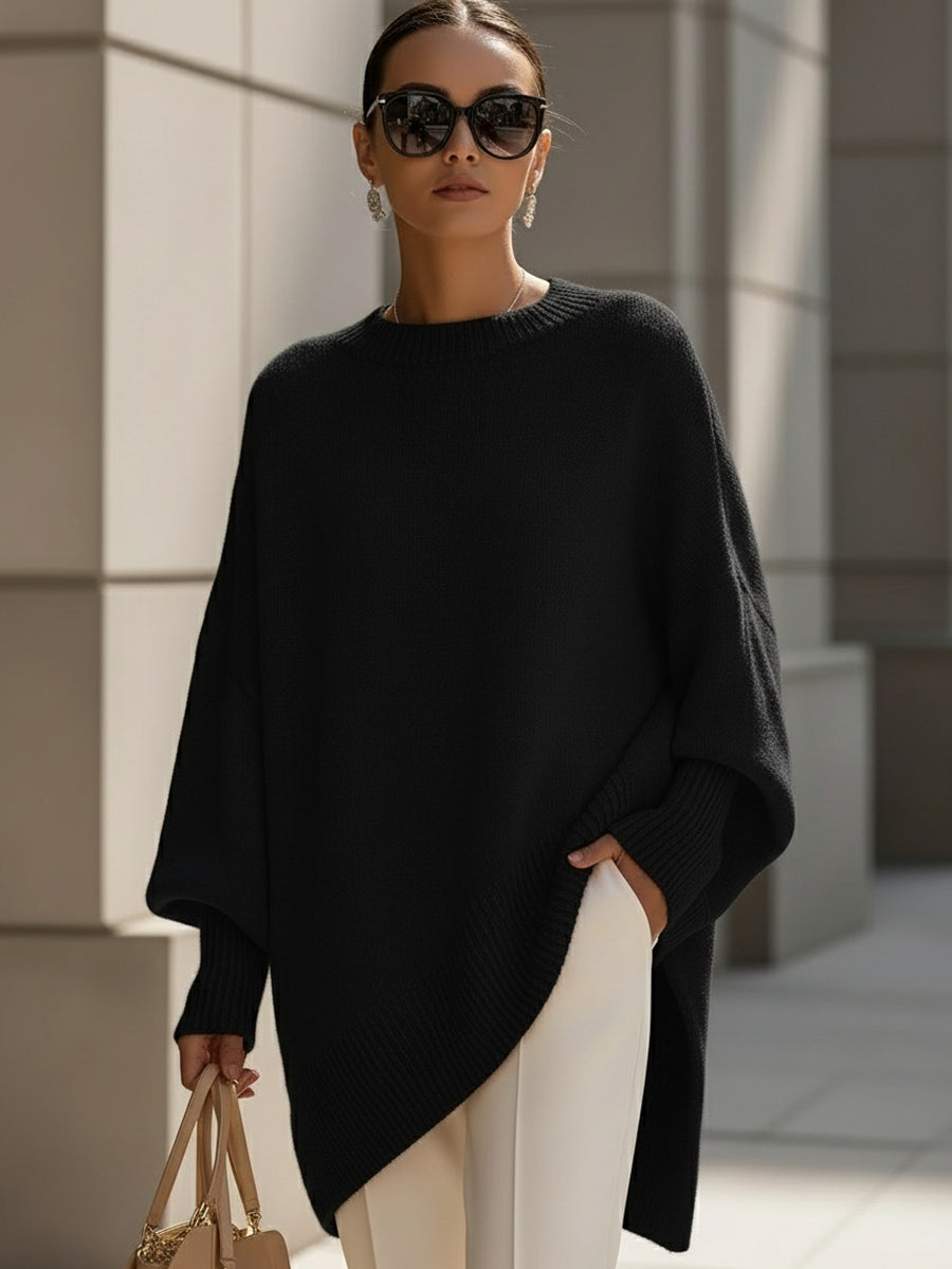 Women's oversized sweater featuring a cozy knit crew neck design and stylish asymmetrical hem, perfect for casual and comfortable outfits. 2