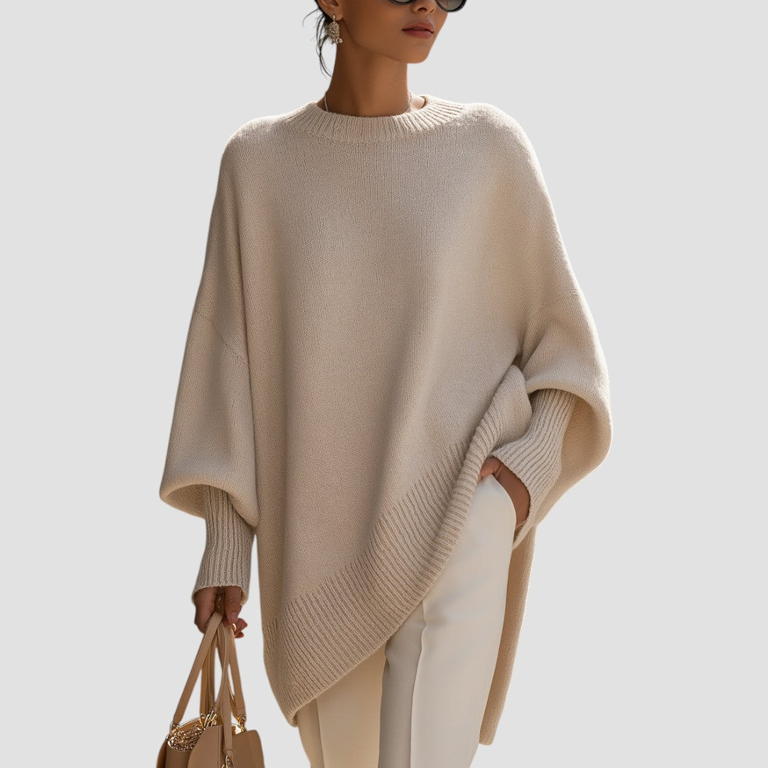 Women's oversized sweater featuring a cozy knit crew neck design and stylish asymmetrical hem, perfect for casual and comfortable outfits. 3
