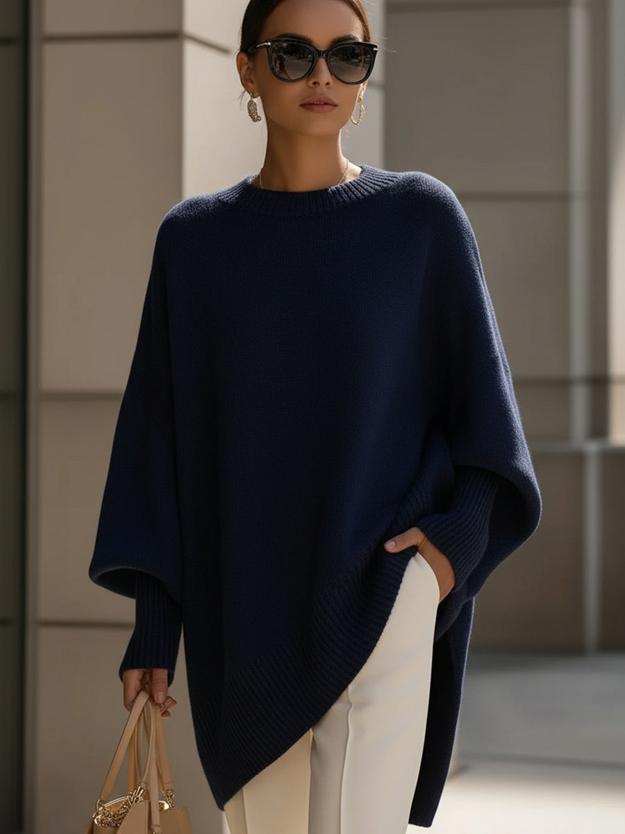 Women's oversized sweater featuring a cozy knit crew neck design and stylish asymmetrical hem, perfect for casual and comfortable outfits. 5