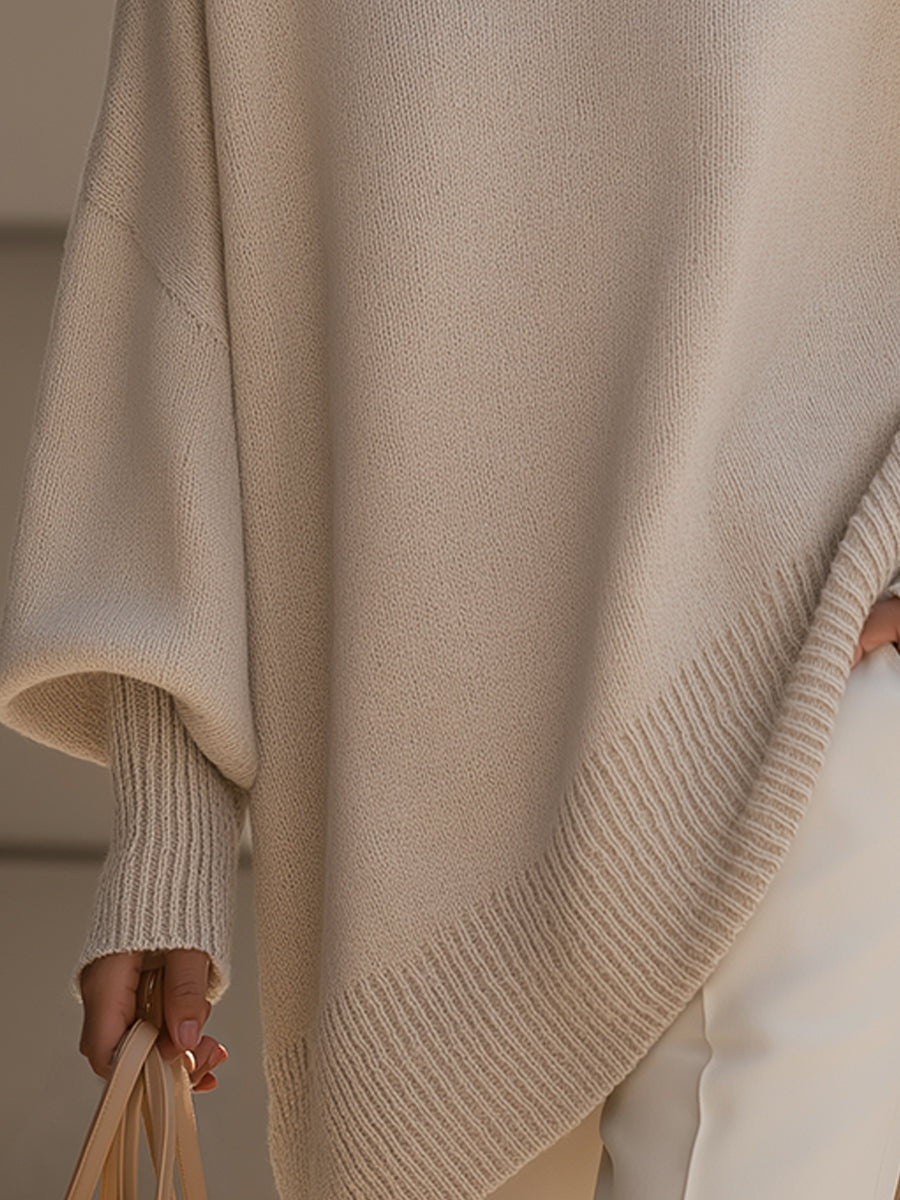 Women's oversized sweater featuring a cozy knit crew neck design and stylish asymmetrical hem, perfect for casual and comfortable outfits. 8